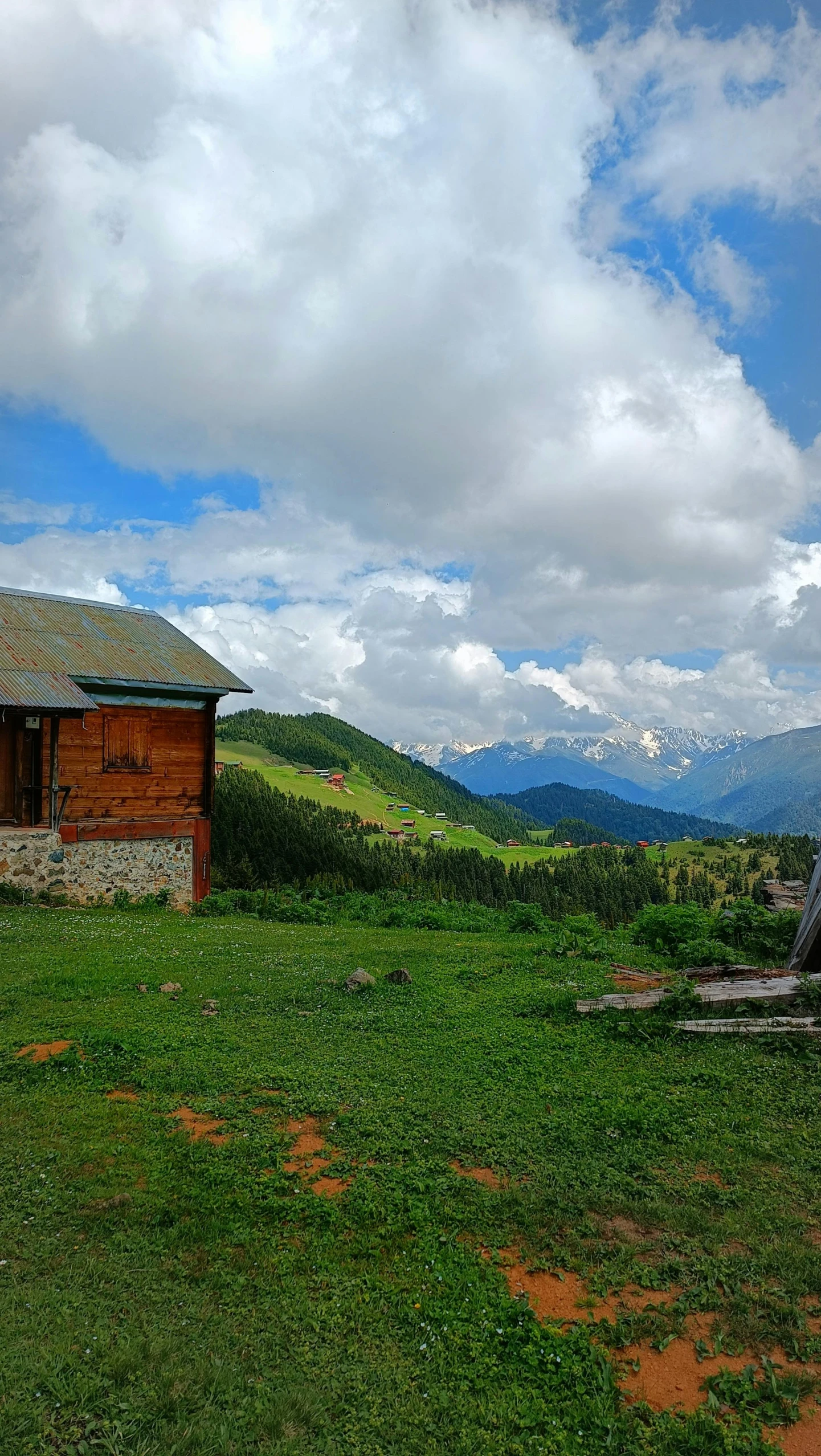 an old wooden cabin on top of a mountain