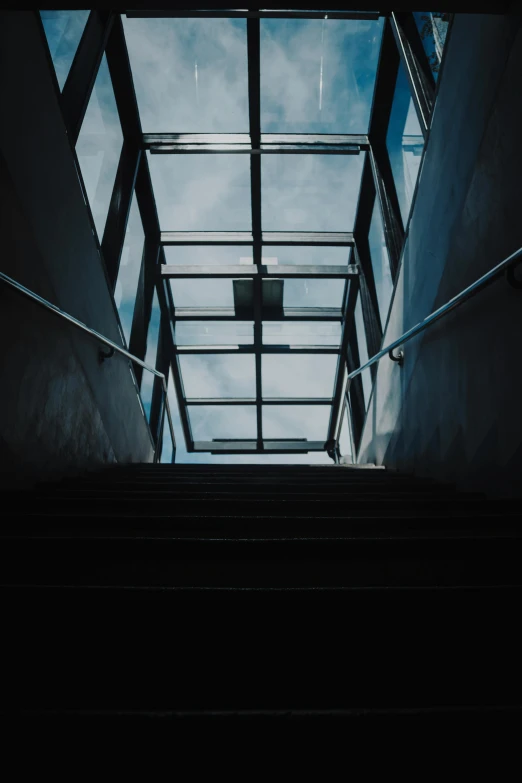 a staircase in a very big building with stairs going up it