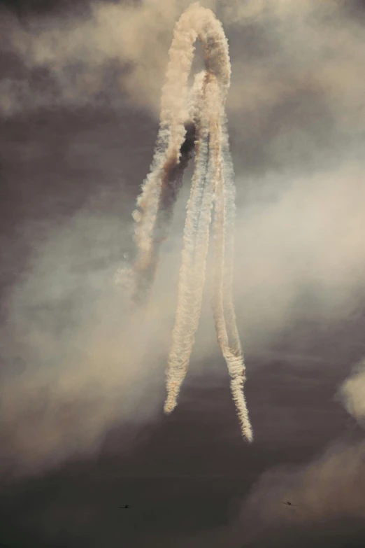 contrails are emitting smoke in the air