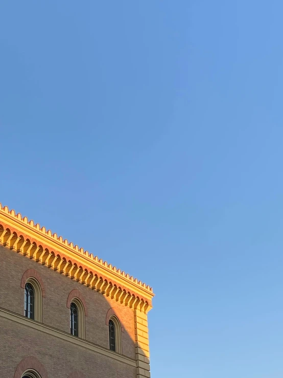 an airplane in the sky over a building