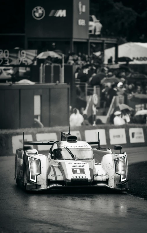 a racer driving through the curve of a track