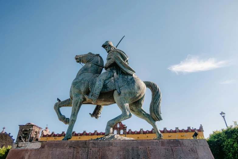 the statue has a knight on it on horseback