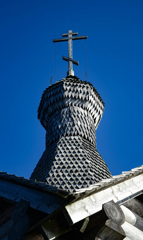 a roof with a building top and cross on it