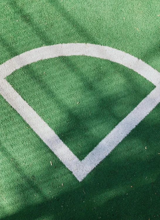 the baseball diamond is in shadow on the field