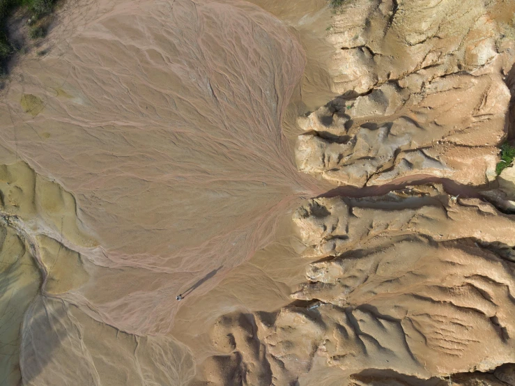 aerial view of some very colorful hills with trees