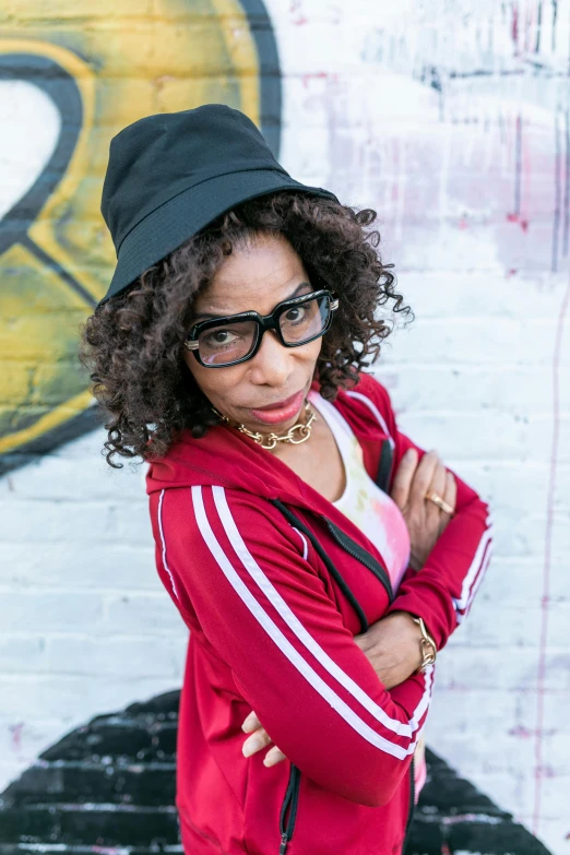 a woman wearing glasses and a black hat