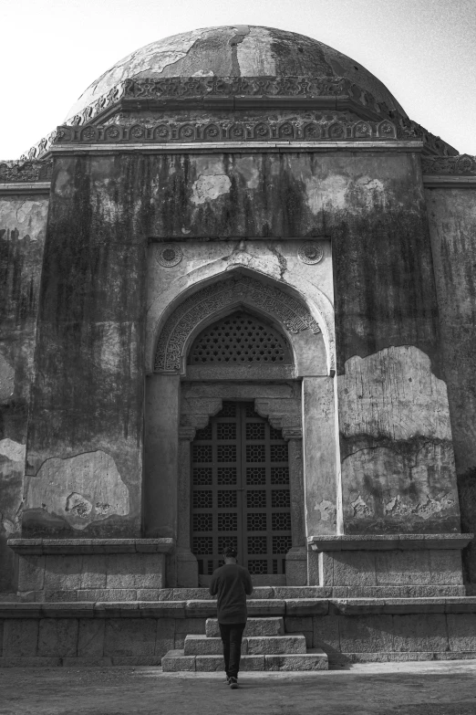 black and white po of the entrance to a palace with its door open