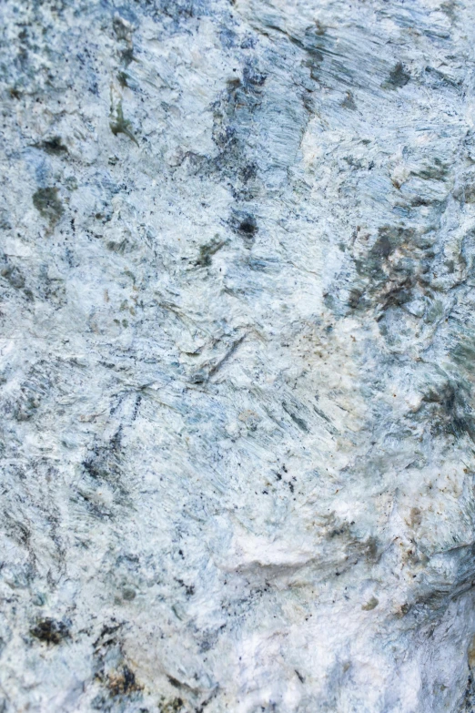 a close up of a surface with brown and white patterns