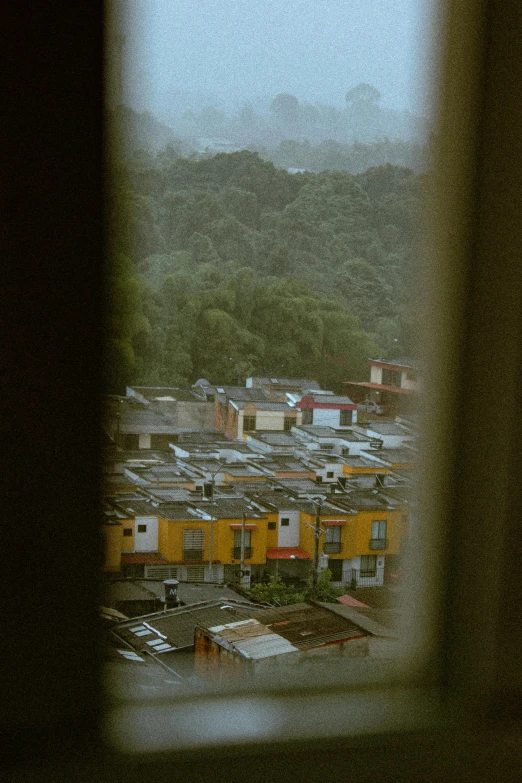 view through an open window at buildings