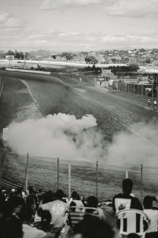 spectators watch the races on a cloudy day