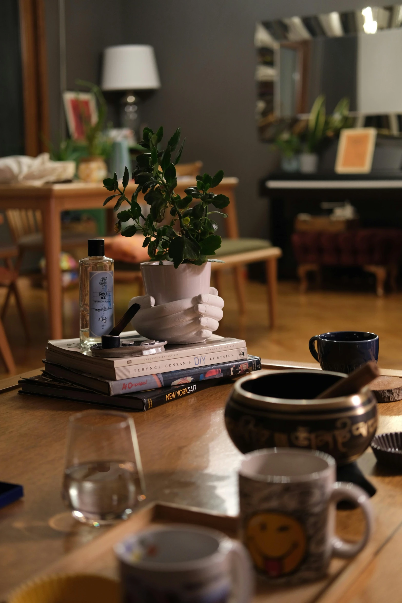 a dining table topped with books and cups