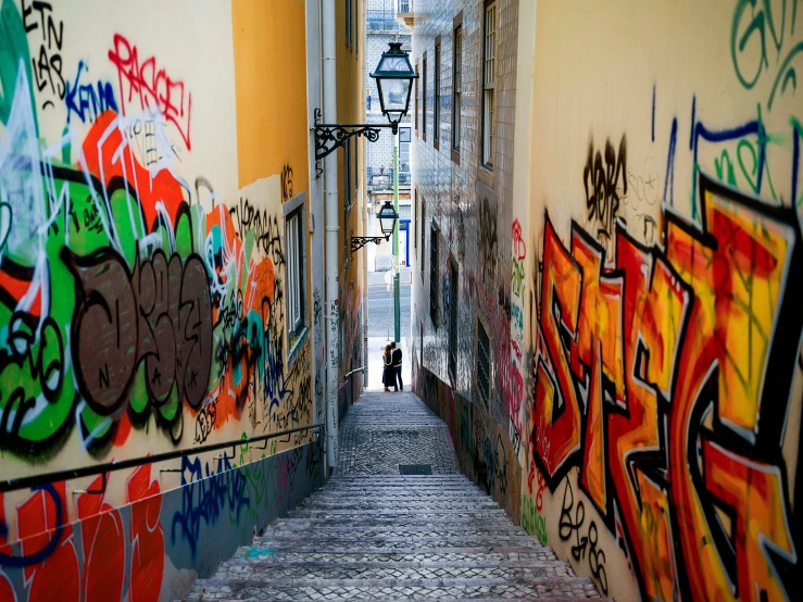 an alley with grafitti walls and lights