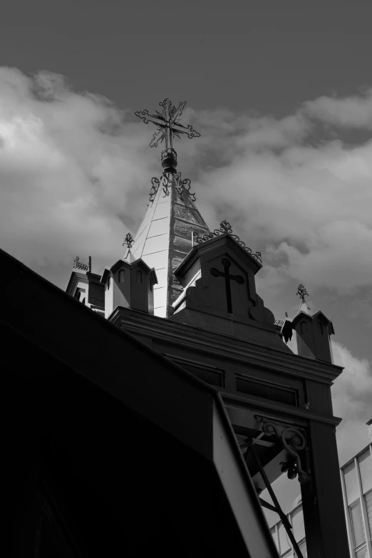 a steeple with a church's cross on top