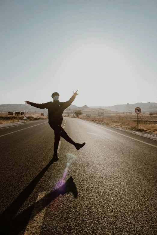 a person leaping in the air on a street