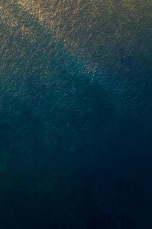 two paddle boats in an open ocean with the same color as the ocean