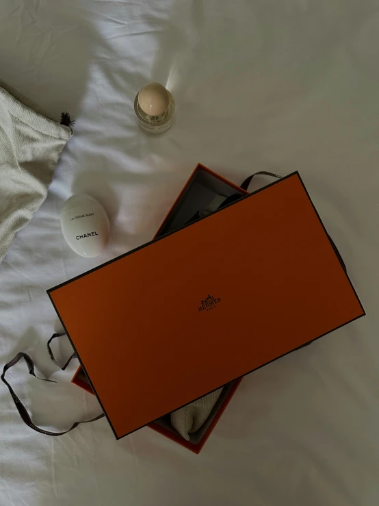 a box that is open sitting on the bed