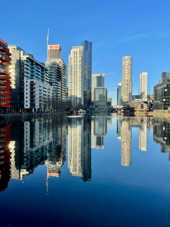 there are some buildings in the city across from water