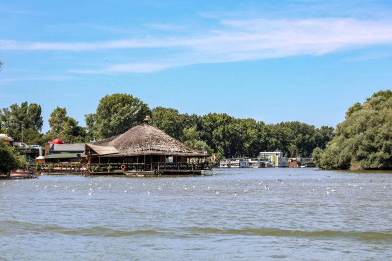 a large body of water with houses and trees around it