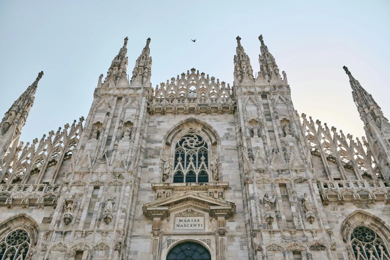 a very tall cathedral with a massive clock tower