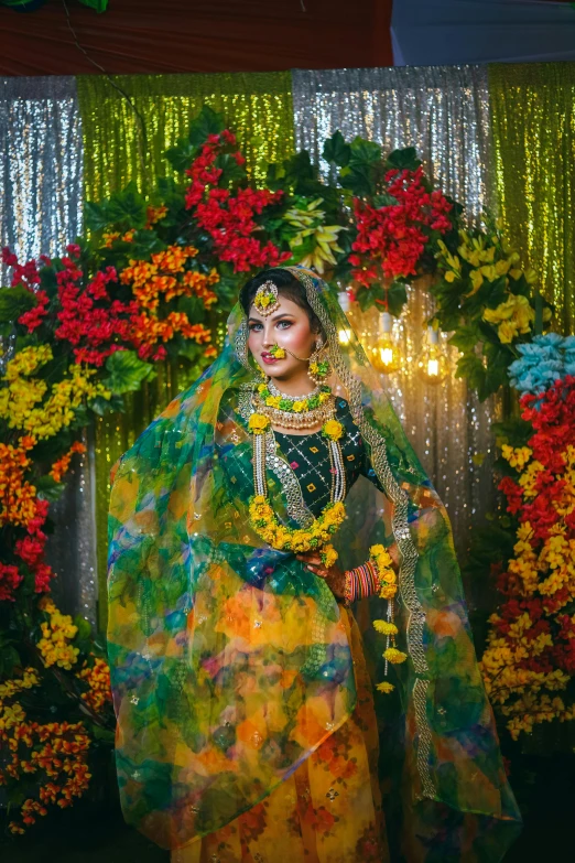 indian bride with floral garland and colorful sari