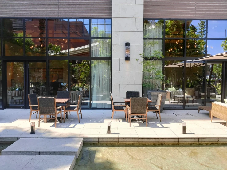 an outdoor dining area with the outside patio in front of the building