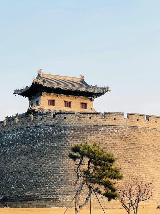 an ornate structure with chinese architecture built on the wall