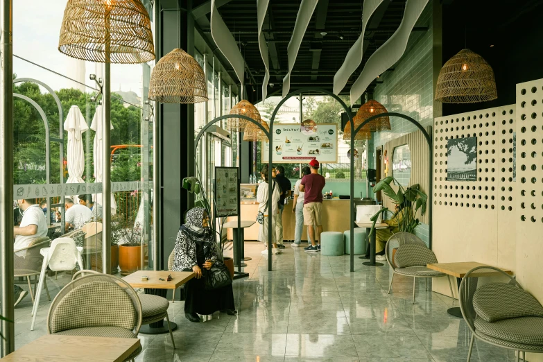 a few people looking at furniture in a store