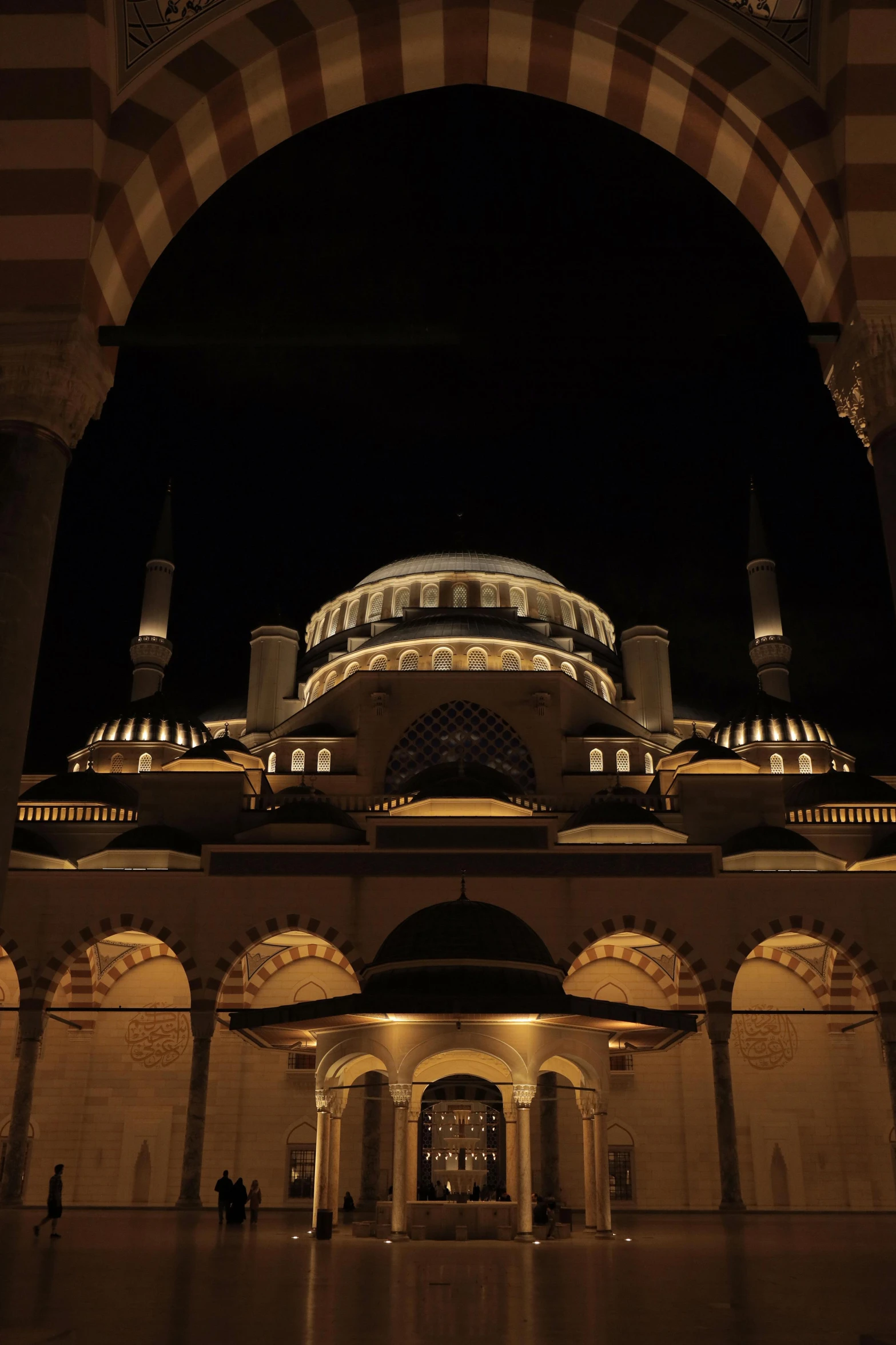 a dome covered building with lights in the middle