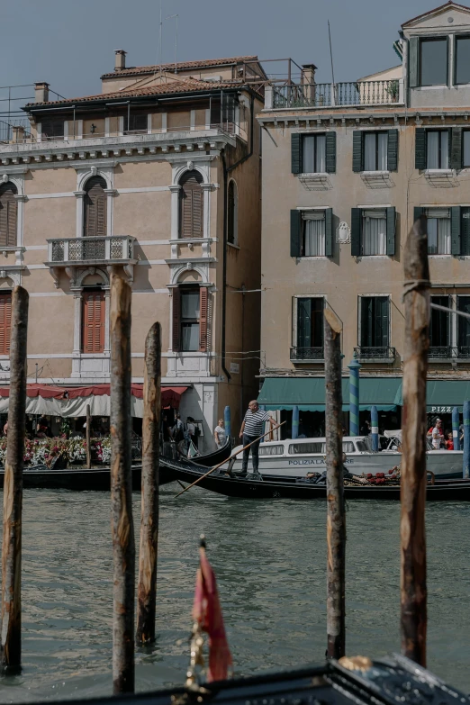 the buildings are located next to each other on the water