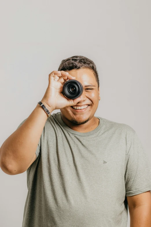 a smiling man with a camera on his head