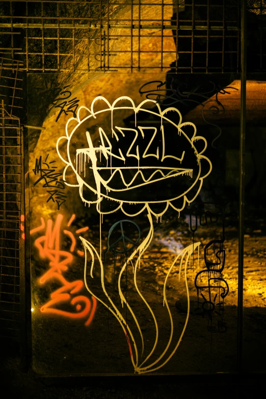 a neon flower sits in front of a dark, graffiti covered entrance