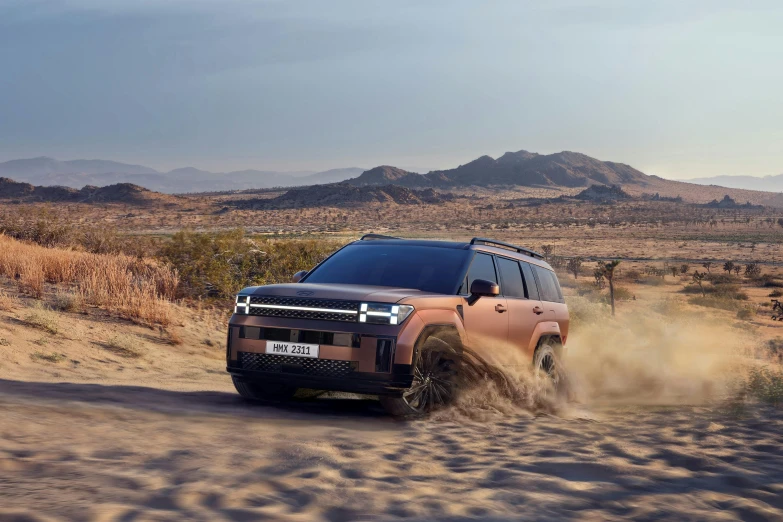 an orange suv driving down the dirt road