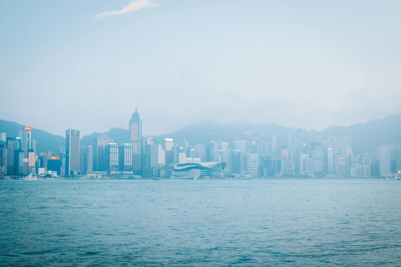 the city skyline is covered in thick fog