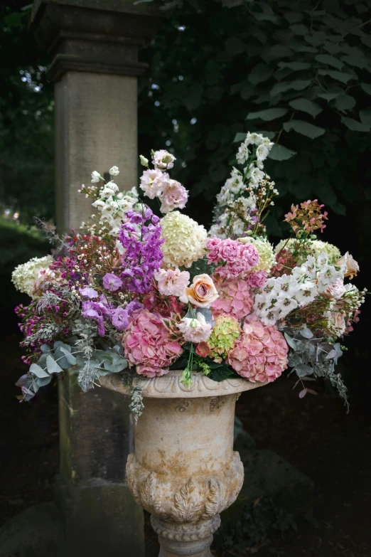 a bouquet of colorful flowers in a white vase