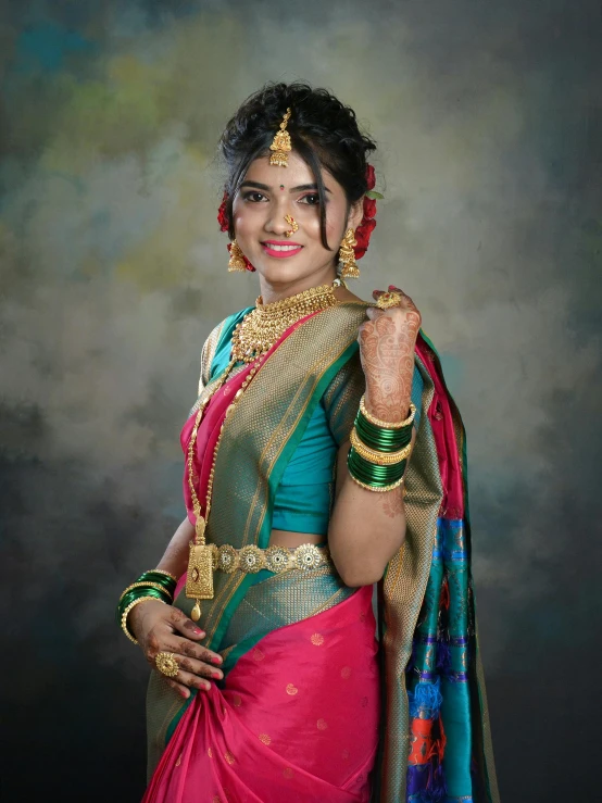 a woman in a indian saree wearing jewelry and pearls