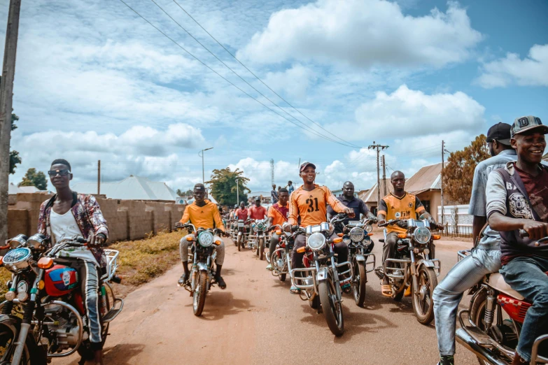 a group of young people riding on motorcycles