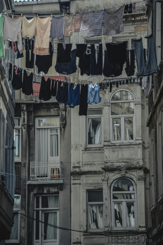 clothes hung in front of a rundown building