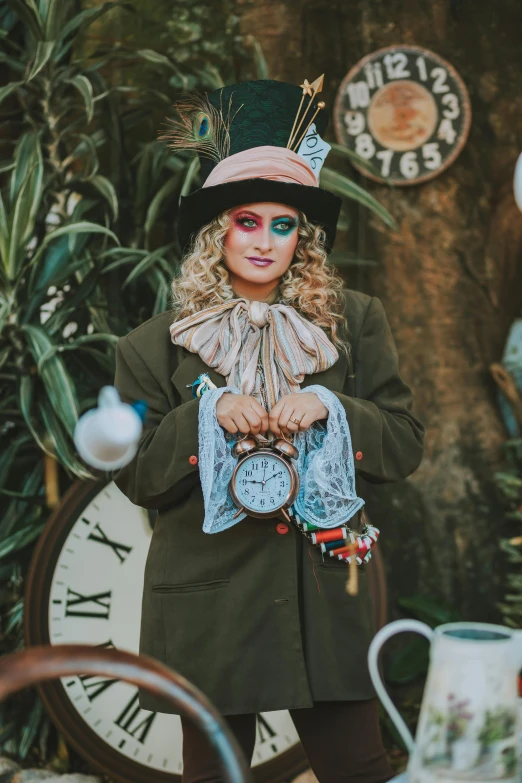 a woman wearing a green coat and hat