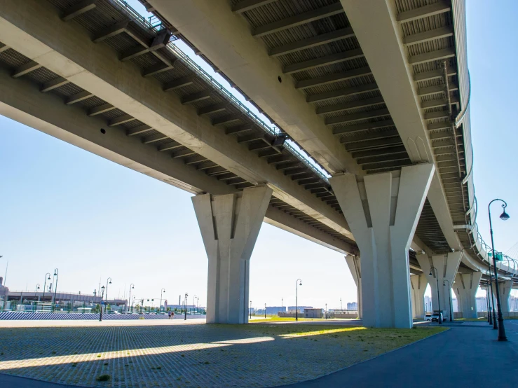 looking at the underside of an overpass bridge