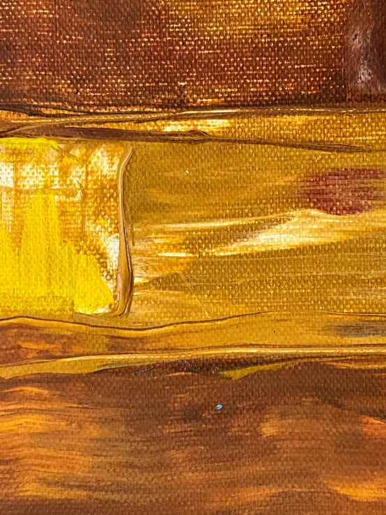 a close up view of an orange and brown painting