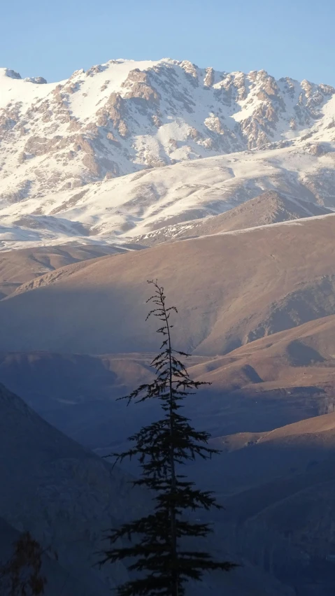 a snow capped mountain sitting in the distance