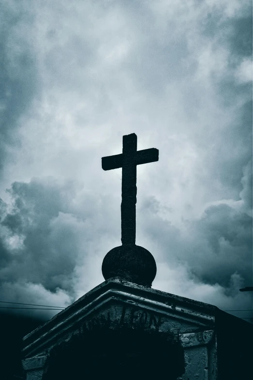 a large cross on top of a church