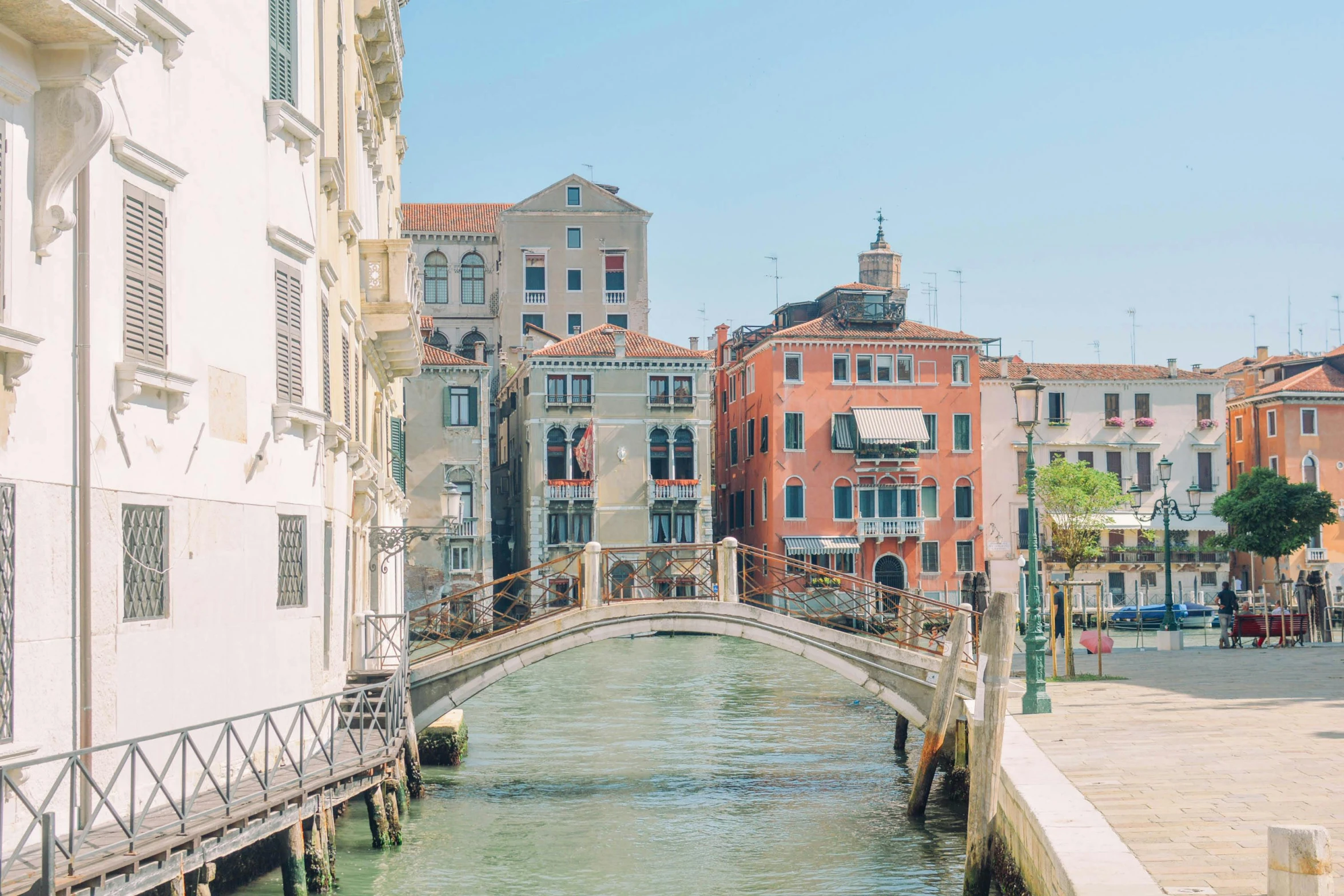 a street scene with a waterway and buildings