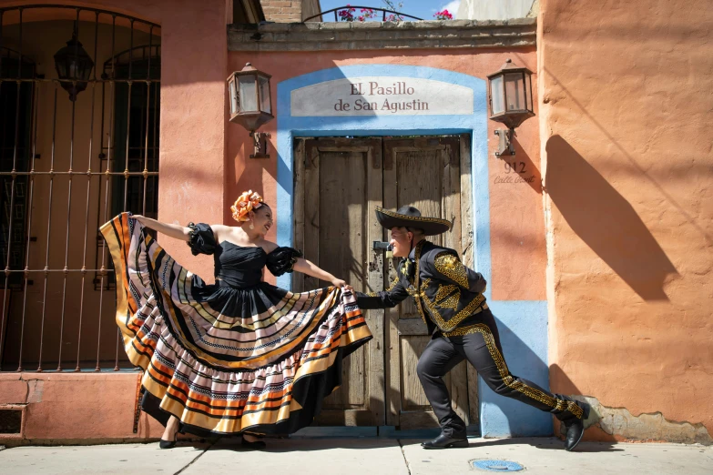 two people are in costume posing for a picture