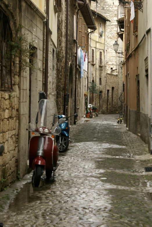 a street with scooters parked on both sides