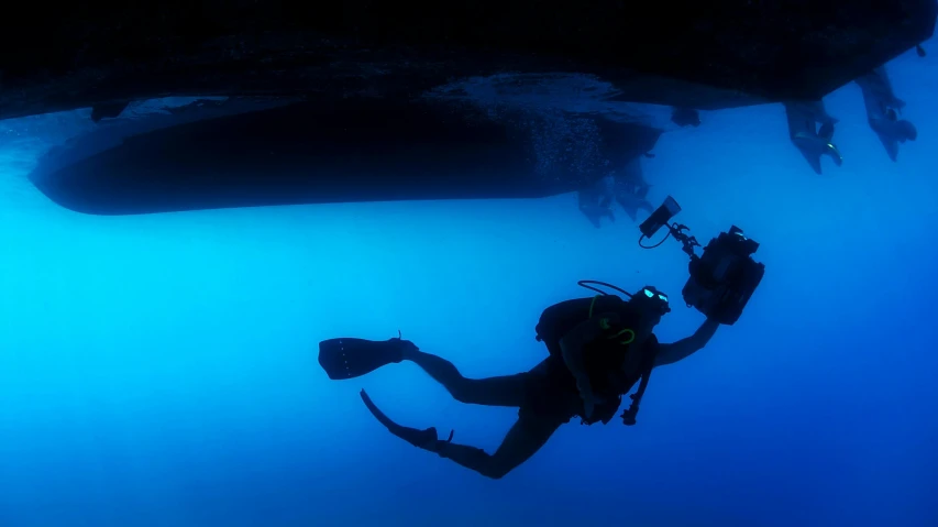 a scuba diver is in the blue water