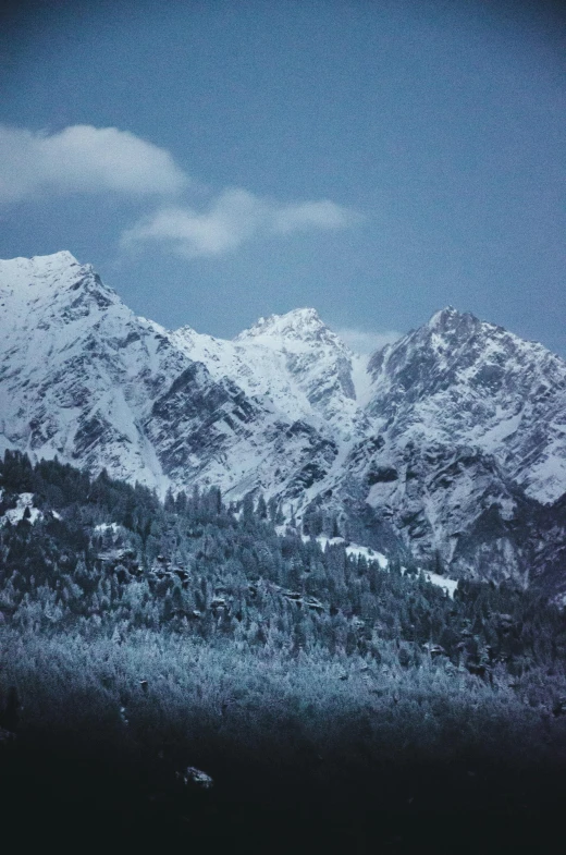 a mountain with lots of snow covered mountains