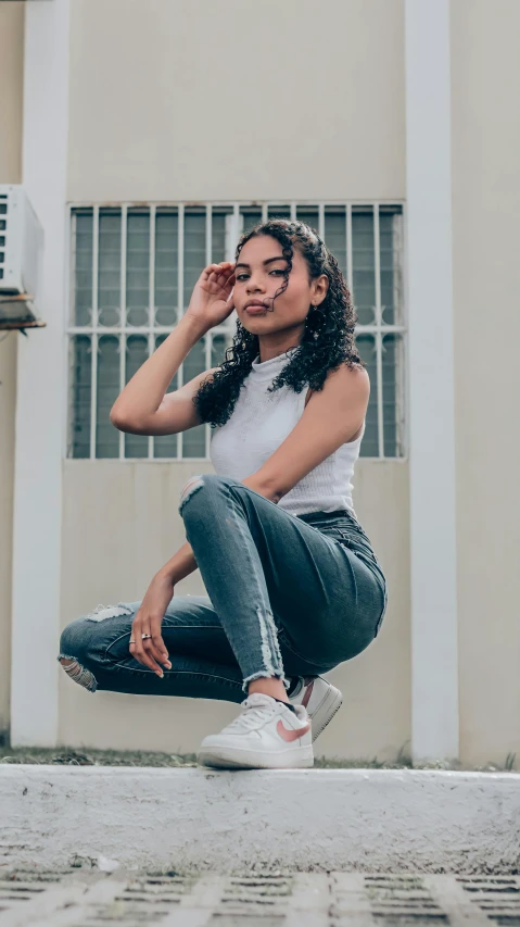 a woman sitting on the ground with her eyes open