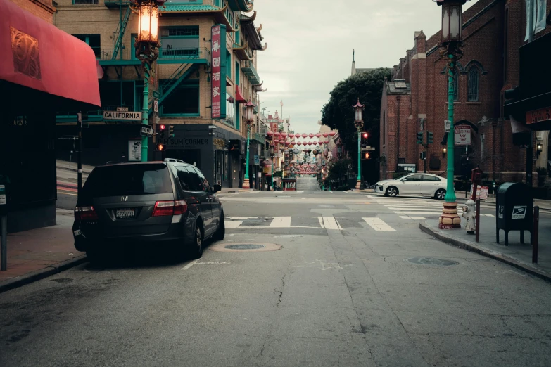 a street with a car and a bus at an intersection