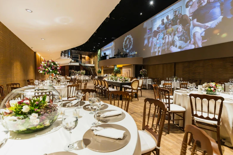 a large screen mounted to the wall in a restaurant